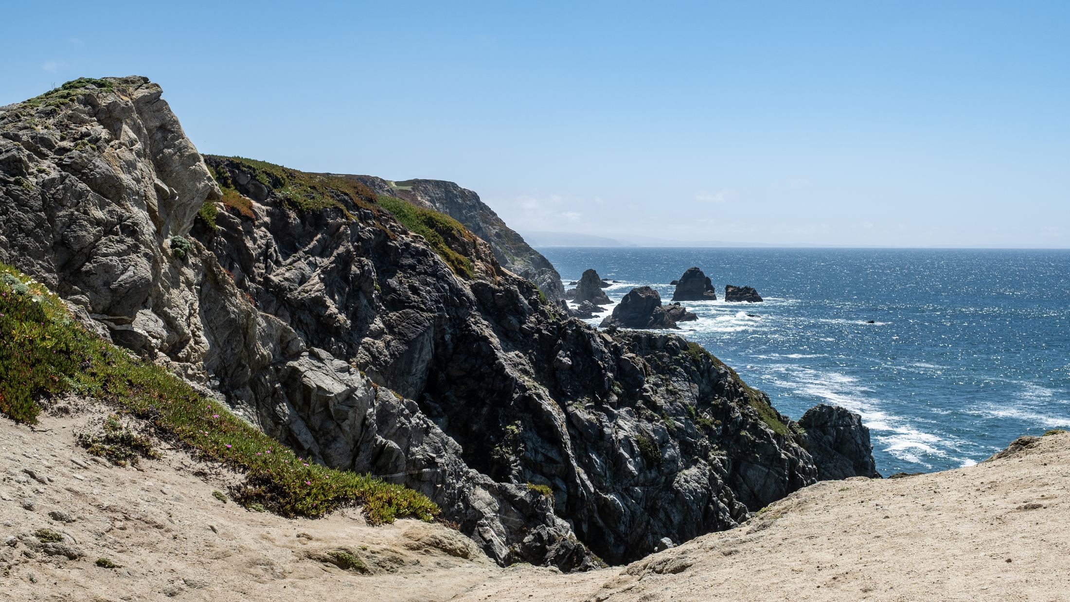 Rocky cliffs and surf on the Pacific at Bodega Bay