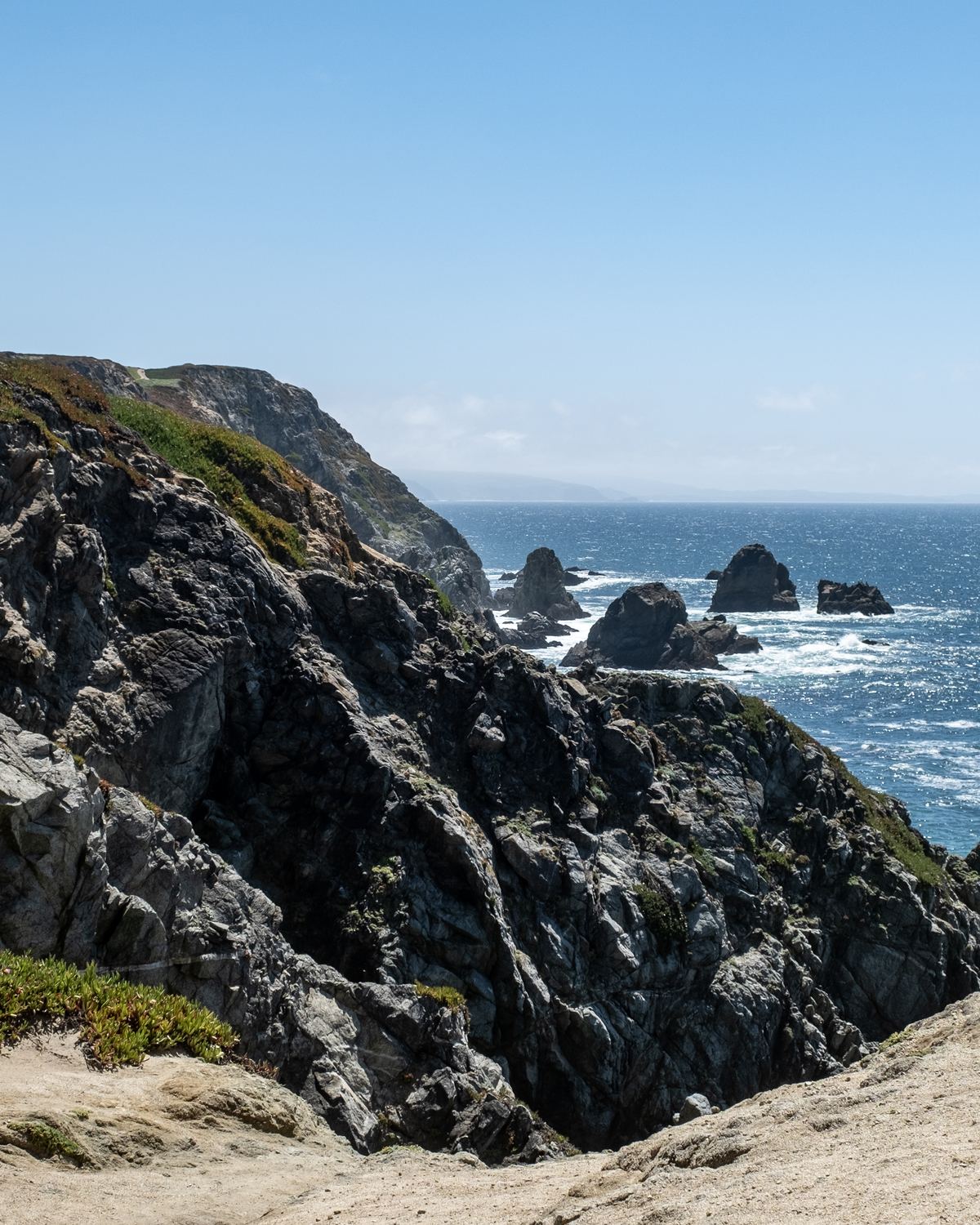Rocky cliffs and surf on the Pacific at Bodega Bay